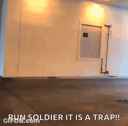 A White Wall With The Words Run Soldier It Is A Trap Written On It GIF