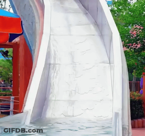 A White Water Slide Is Going Down A Slope GIF