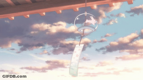A Wind Chime With A Rabbit On It Hangs From The Roof GIF