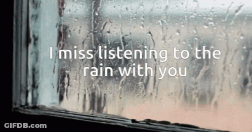 A Window With Rain Drops On It And The Words " I Miss Listening To The Rain With You " Above It GIF