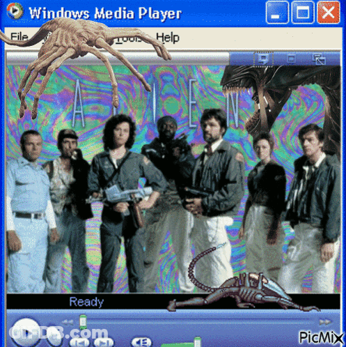 A Windows Media Player Screen Shows A Group Of People And An Alien GIF