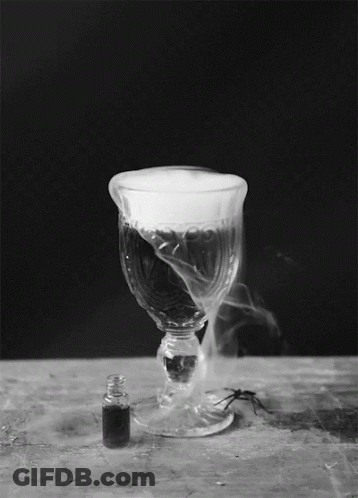 A Wine Glass With Smoke Coming Out Of It GIF