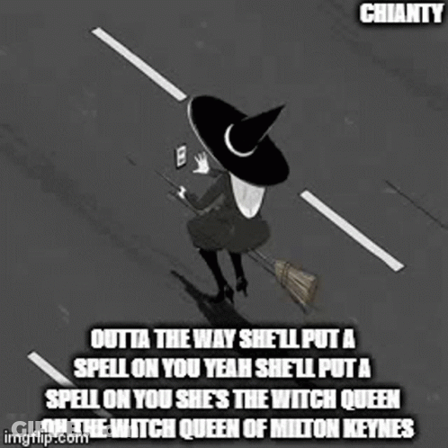 A Witch Is Sitting On A Broom In The Middle Of A Street . GIF