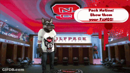 A Wolf Mascot Stands In A Locker Room With The Words Pack Nation Show Them Your Fangs GIF
