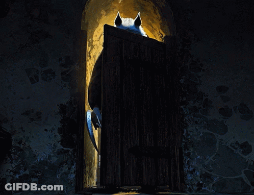 A Wolf With Red Eyes Is Standing In A Dark Doorway GIF