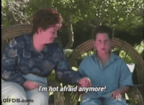 A Woman And A Boy Are Sitting On A Wicker Bench And The Boy Says I 'M Not Afraid Anymore GIF