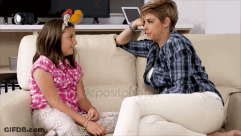 A Woman And A Girl Are Sitting On A Couch Talking GIF