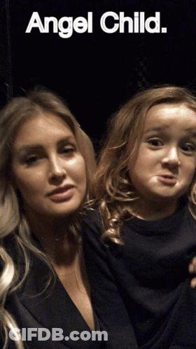 A Woman And A Little Girl Are Posing For A Picture With The Words Angel Child Above Them GIF