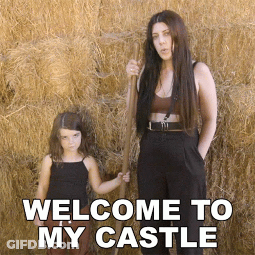 A Woman And A Little Girl Are Standing In Front Of Hay Bales With The Words Welcome To My Castle Written On The Bottom GIF
