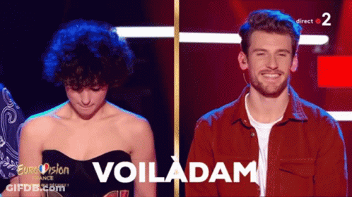 A Woman And A Man Are On A Stage With The Words Voiladam On The Bottom GIF