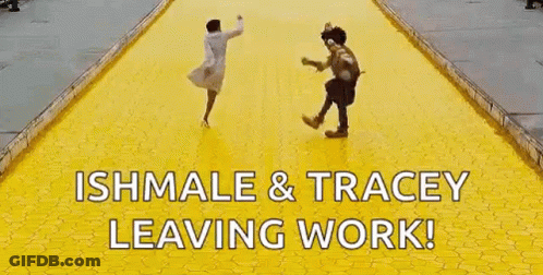 A Woman And A Scarecrow Are Running On A Yellow Tiled Road . GIF