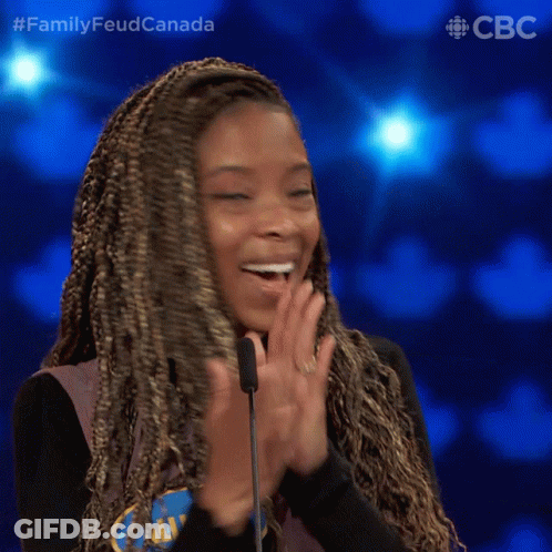 A Woman Applauds In Front Of A Microphone With The Words Family Feud Canada On The Bottom Right GIF