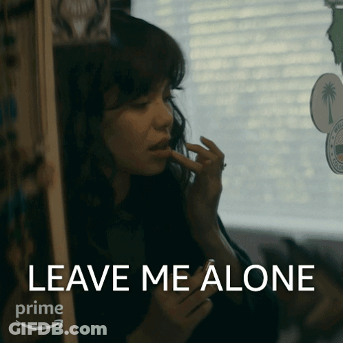 A Woman Applying Makeup With The Words Leave Me Alone In The Corner GIF