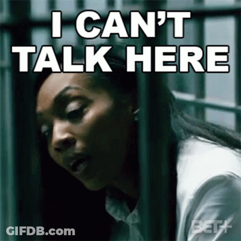 A Woman Behind Bars With The Words I Can T Talk Here GIF