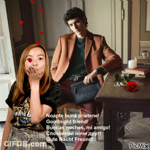 A Woman Blowing A Kiss Next To A Man Sitting At A Table With A Red Rose GIF