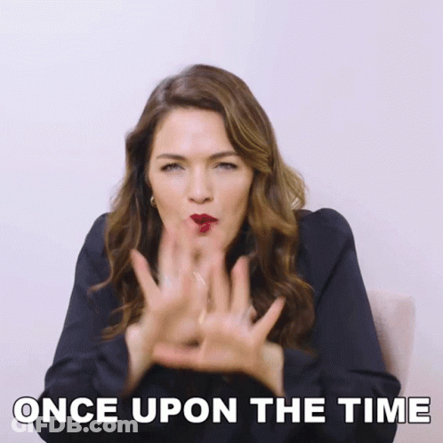 A Woman Blowing A Kiss With The Words " Once Upon The Time " Below Her GIF