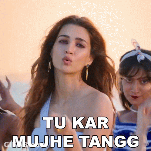 A Woman Blowing A Kiss With The Words Tu Kar Mujhe Tangg Written Below Her GIF