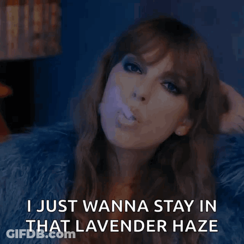 A Woman Blowing A Purple Bubble With The Words " I Just Wanna Stay In That Lavender Haze " Below Her GIF