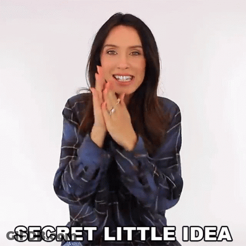 A Woman Clapping Her Hands With The Words Secret Little Idea Written Below Her GIF