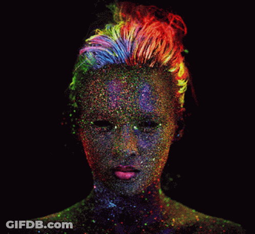 A Woman Covered In Glow In The Dark Paint GIF
