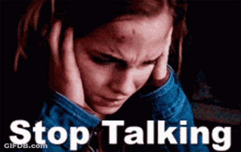 A Woman Covering Her Ears With Her Hands And The Words " Stop Talking " Behind Her GIF