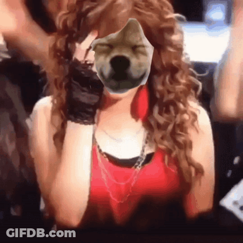 A Woman Covering Her Face With A Picture Of A Dog 'S Face GIF