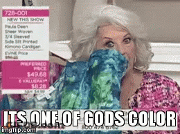 A Woman Covering Her Face With A Sweater That Says It 'S One Of Gods Color On It GIF