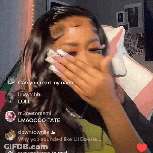 A Woman Covering Her Face With Her Hand And A Few Comments Including One That Says ' Can You Read My Name ' GIF