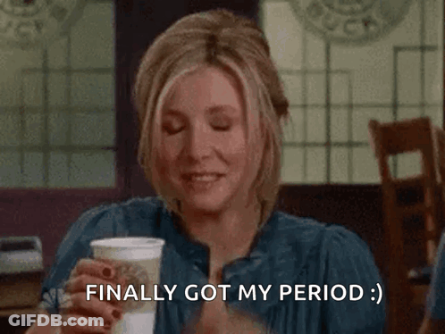 A Woman Covering Her Face With Her Hand While Holding A Cup Of Coffee And Saying Finally Got My Period . GIF