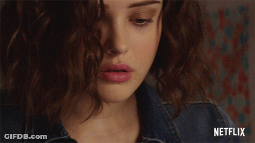 A Woman Covering Her Face With Her Hand With A Netflix Logo In The Corner GIF