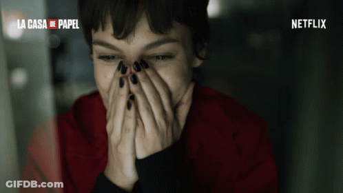A Woman Covering Her Face With Her Hands And The Words La Casa De Papel Behind Her GIF