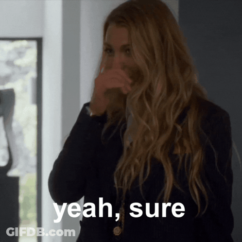 A Woman Covering Her Mouth With Her Hand With The Words Yeah Sure Written Below Her GIF