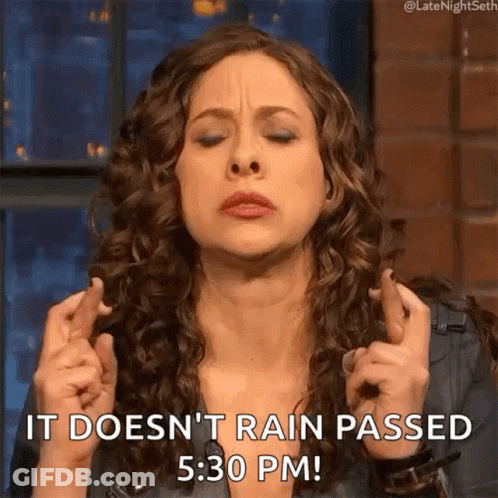 A Woman Crosses Her Fingers And Says It Does N't Rain Passed 5:30 Pm . GIF