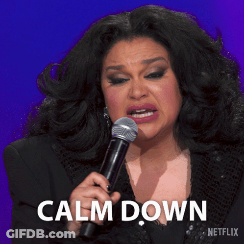 A Woman Crying While Holding A Microphone With The Words Calm Down Written Below Her GIF