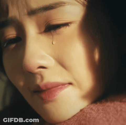 A Woman Crying With A Tear Coming Out Of Her Eye GIF