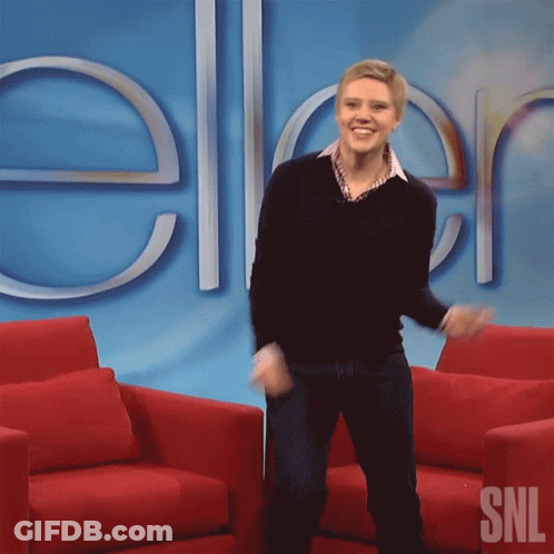 A Woman Dancing In Front Of A Sign That Says Snl GIF