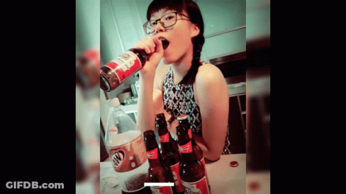 A Woman Drinking A Bottle Of Root Beer From A Can GIF