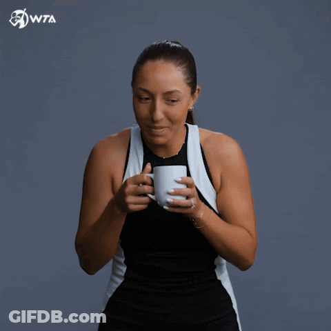 A Woman Drinking From A Cup With Wta Written On The Bottom Right GIF