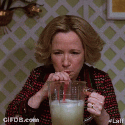 A Woman Drinking From A Pitcher With A Straw And The Hashtag #Laff GIF