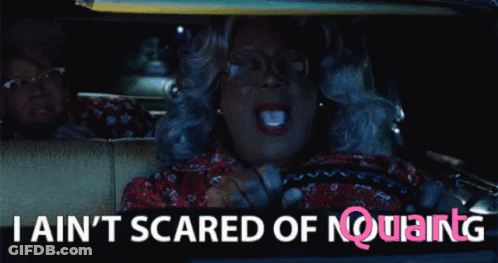 A Woman Driving A Car With The Words " I Ain T Scared Of Nothing " GIF