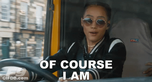 A Woman Driving A Car With The Words Of Course I Am On The Screen GIF