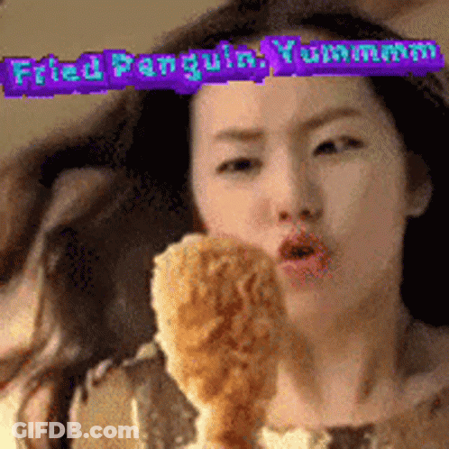 A Woman Eating A Fried Penguin With The Words Fried Penguin Yummy In The Corner GIF