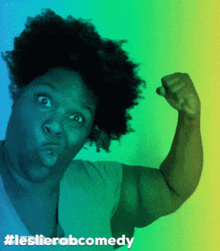 A Woman Flexing Her Muscles With The Hashtag Leslierobcomedy GIF