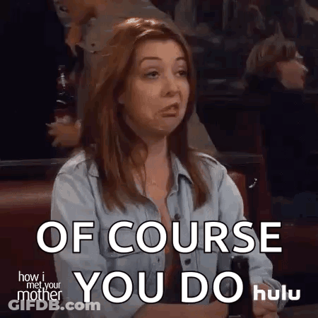 A Woman From How I Met Your Mother Is Sitting At A Table And Making A Face . GIF