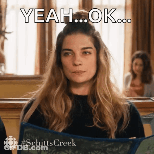 A Woman From Schitts Creek Is Holding A Blue Scarf GIF