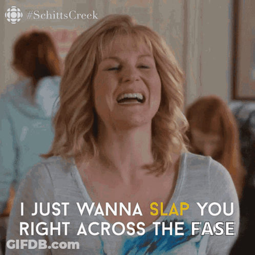 A Woman From Schitts Creek Is Laughing And Saying " I Just Wanna Slap You Right Across The Face " GIF