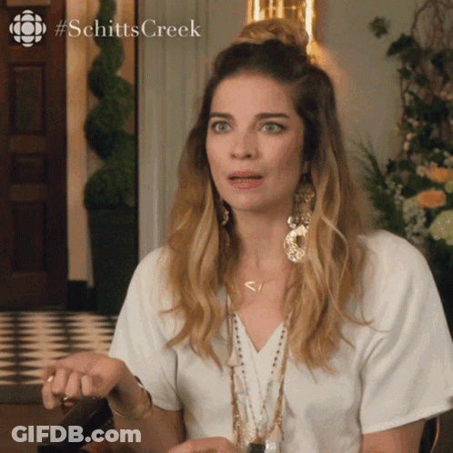 A Woman From Schitts Creek Making A Surprised Face GIF