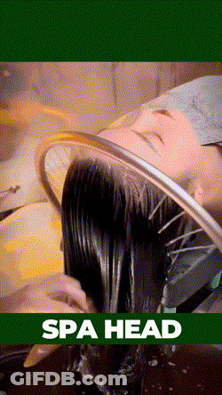 A Woman Getting Her Hair Washed In A Spa Head GIF