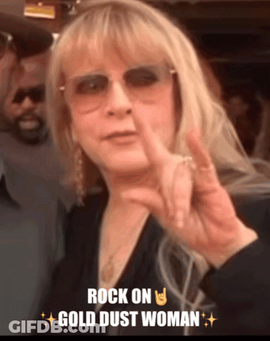A Woman Giving A Peace Sign With The Words Rock On Gold Dust Woman GIF