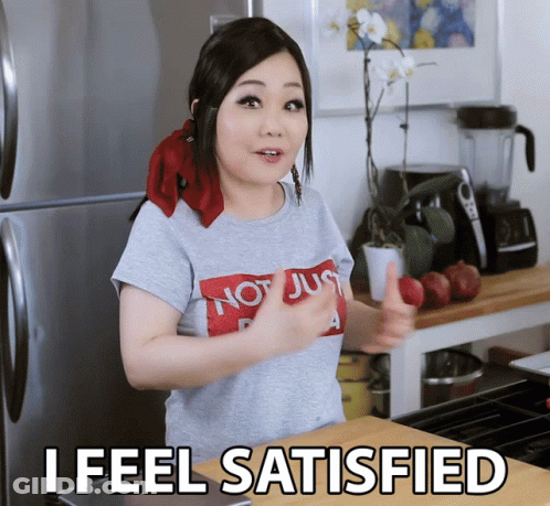 A Woman Giving A Thumbs Up With The Words I Feel Satisfied Underneath Her GIF